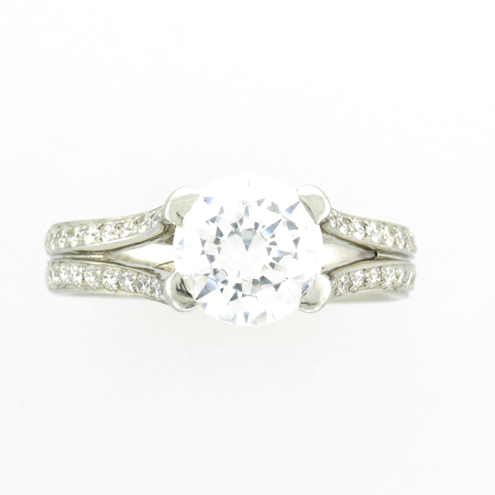 platinum and diamond ring has a mounting for a 2 carat round stone and pave settings with 0.45 carats in VS diamonds.