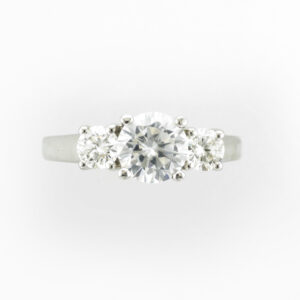 14 karat white gold ring has a trellis for the prongs and side diamonds with a total carat weight of 0.50 and are FG/VS.