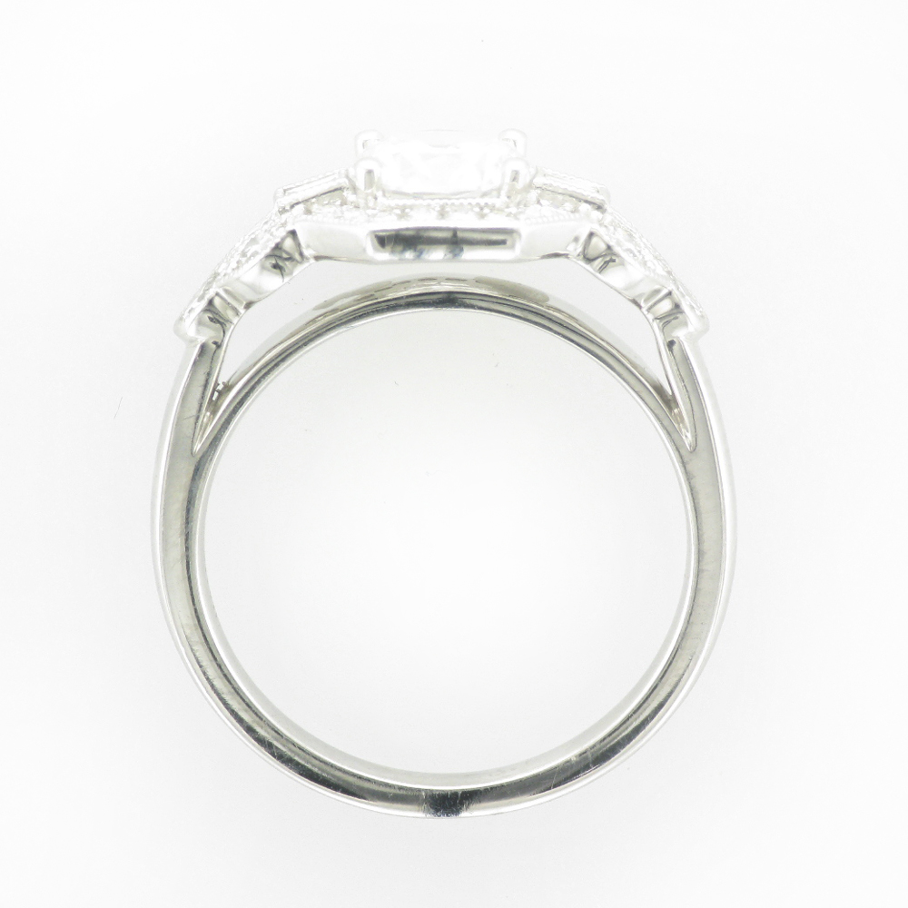 14 karat white gold ring has a deco design that will hold a 1.0 carat stone in the center and has 0.57 carats of side stones.