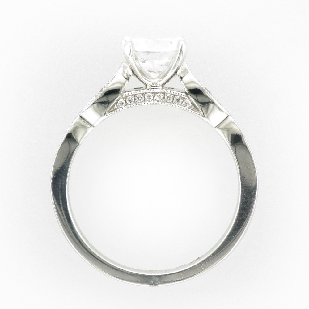 14 karat white gold ring has prongs for a 1.0 carat center stone and has 0.26 carats of side stones.