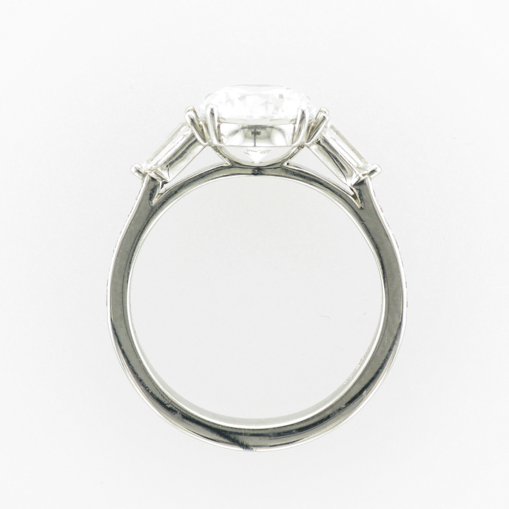 This platinum engagement mounting for a 2 carat stone has two longer side diamonds with a total carat weight of 0.47 and 14 smaller diamonds with a total weight of 0.11 carats.