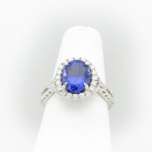 This 18 karat white gold ring has a 2.96 carat fine tanzanite in the center and diamonds with total carat weight of 0.78.