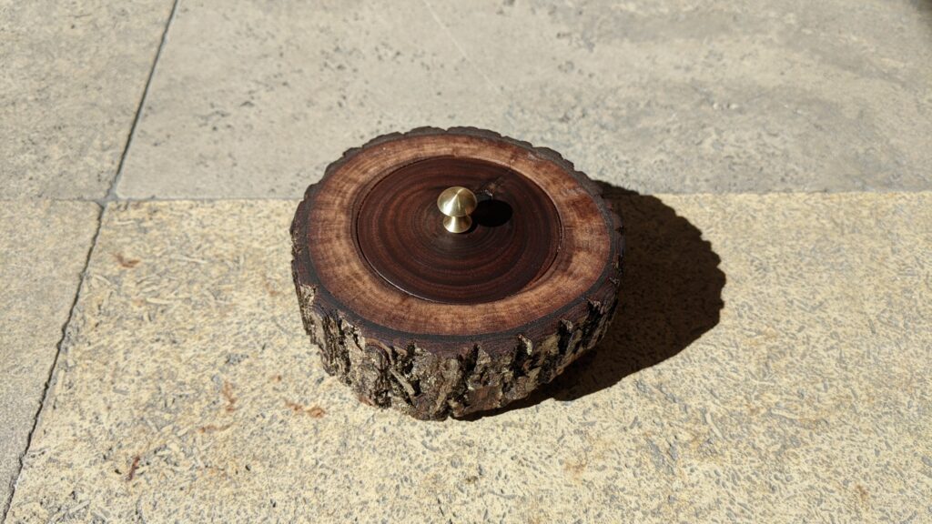 Walnut box with platinum ring with walnut inlay, wood supplied by customer, lid on with mushroom shaped brass handle